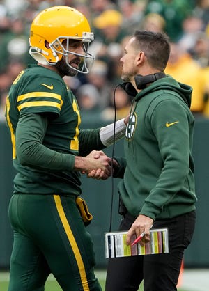 Green Bay Packers quarterback Aaron Rodgers and head coach Matt LaFleur talk during the third quarter of Sunday's loss to the New York Jets at Lambeau Field.