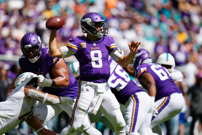 Minnesota Vikings quarterback Kirk Cousins throws a pass against the Miami Dolphins during the second quarter at Hard Rock Stadium.