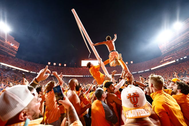 Tennessee fans tear down the goal post after the Volunteers defeated Alabama 52-49 Saturday, Oct. 15, 2022, in Knoxville, Tenn.