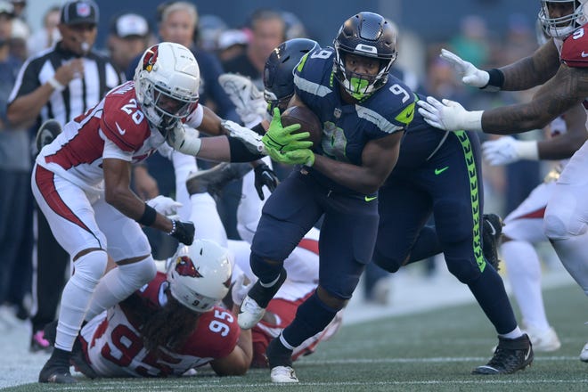 Seattle Seahawks running back Kenneth Walker III (9) runs against the Arizona Cardinals during the second half of an NFL football game in Seattle, Sunday. (AP Photo/Caean Couto)