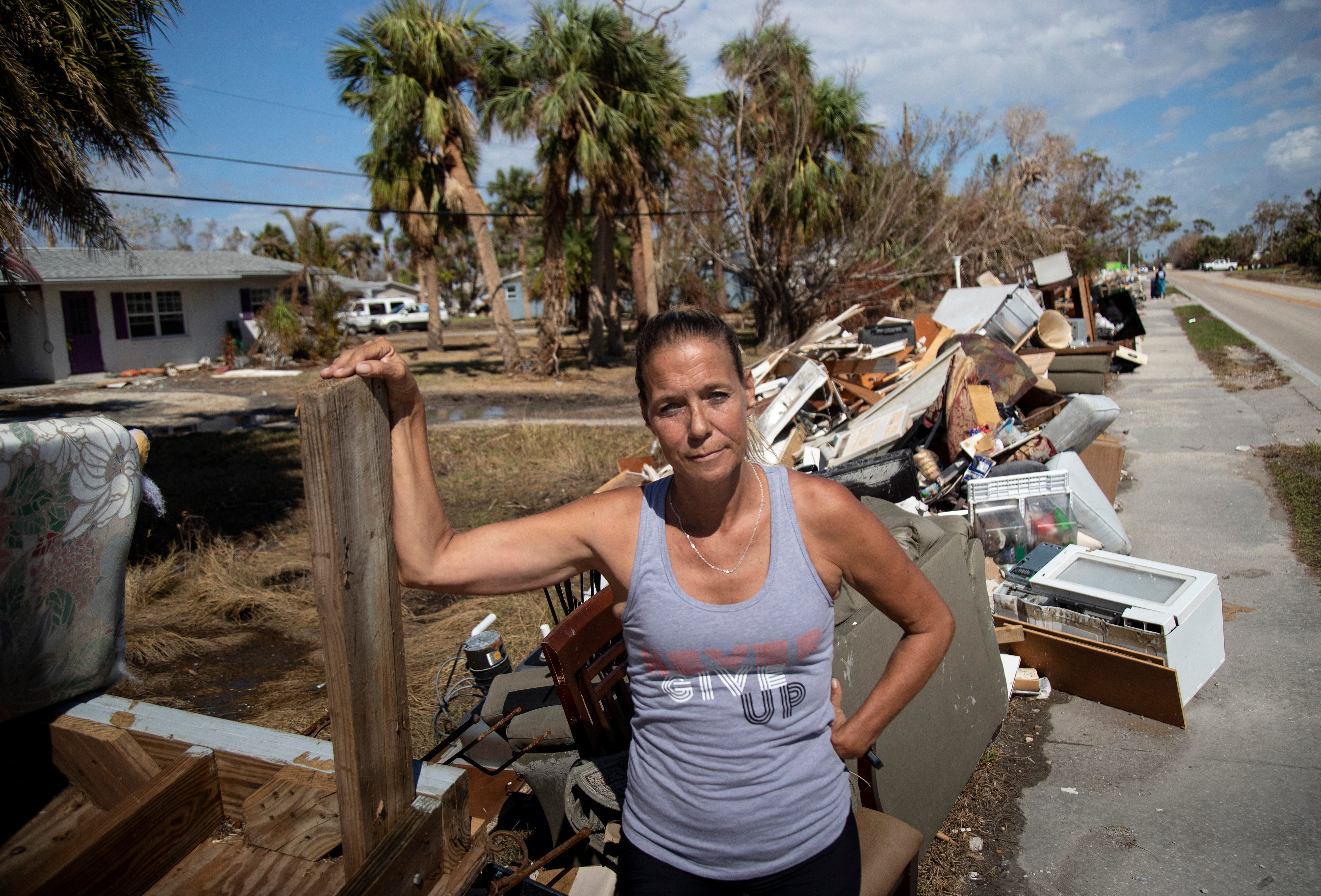 Rachel Helgerson's shirt reads "Never Give Up," and she's ready for a new adventure, but she says it won't be in Fort Myers. "There's nothing left for me here," Helgerson said. She lost everything in the storm surge during Hurricane Ian.