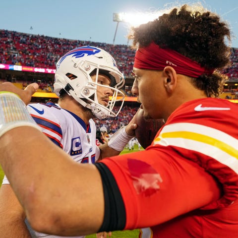 Bills quarterback Josh Allen hugs Chiefs quarterba
