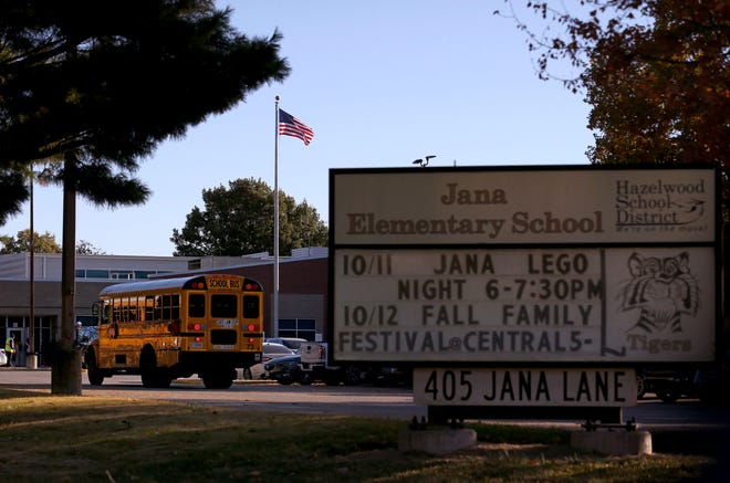 A school bus arrives at Jana Elementary School on Monday, Oct. 17, 2022 in Florissant, Mo. Radioactive samples were found at the Hazelwood School District school, according to a recently released report. Nearby Coldwater Creek, which flooded in August, was contaminated by waste from nuclear bombs manufactured during World War II.