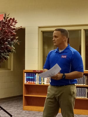 Curriculum coordinator Brian Baughman speaks to the West Holmes Board of Education Monday about the state report card and how West Holmes stacks up compared to similar districts.