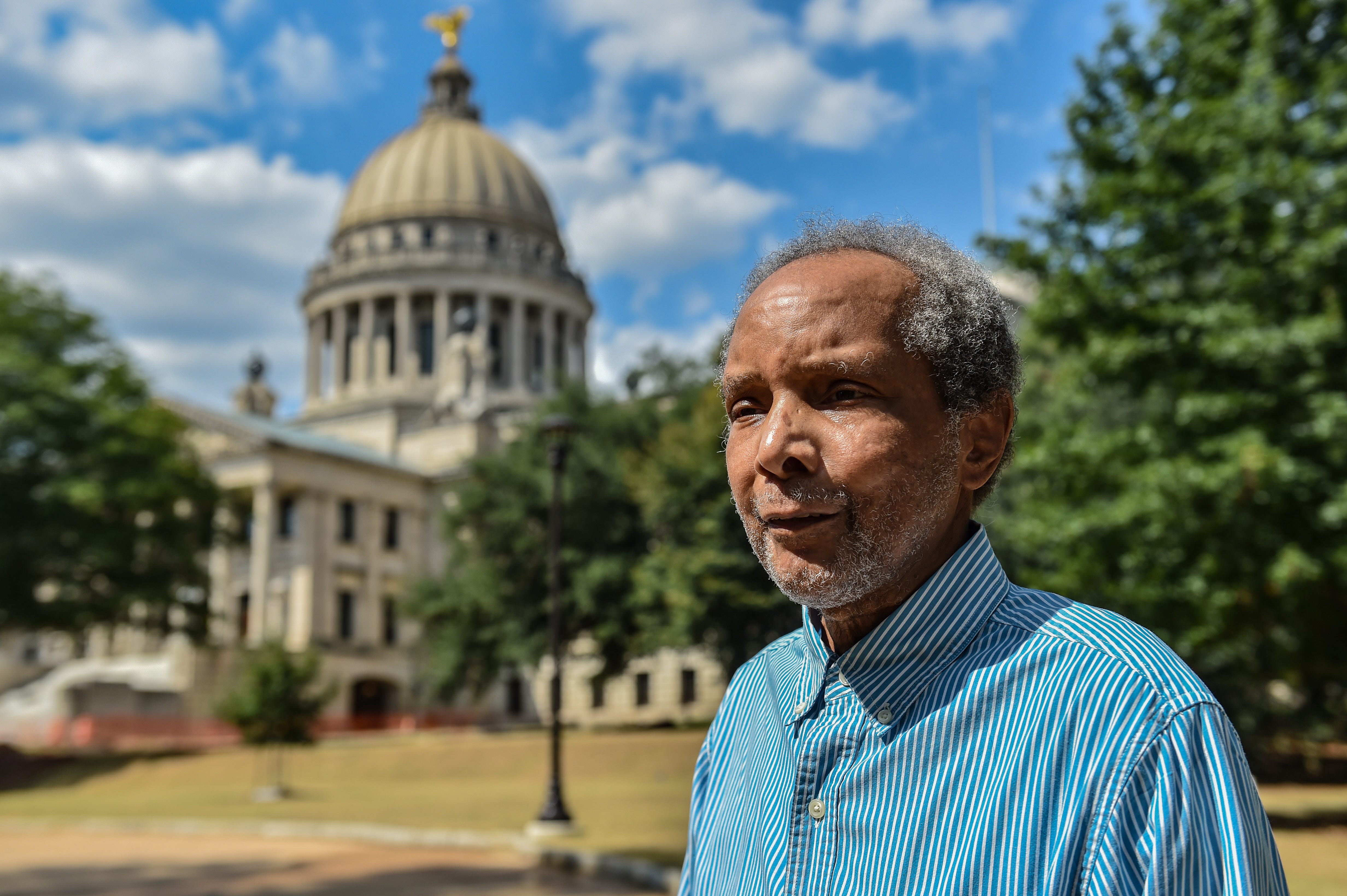 Ronald Gilbert, a former operation supervisor at the O.B. Curtis Water Plant, is seen in front of the State Capitol building in Jackson, Miss., September 16, 2022. The water system, which had always been on a tight budget, started to strain in the late 1990s and things had only gotten worse by the time Gilbert left in 2005.