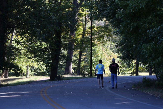 Park-goers got a little exercise as they walked through a path at the Iroquois Park in Louisville, Ky. on Oct. 3, 2022.  
