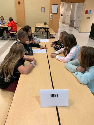 Fourth-graders at West Branch Intermediate School whose birthdays are in June sit together during a lunch period as part of "It Starts With Hello" week. Students on the left, front to back, are Reagan Rife, Cael Miller and Kayliana Stinsman. On the right, front to back, are McKenna Banks, Addilyn Bryte and Taci Stitle. Students wore nametags and were encouraged to say "Hey!" to at least two new friends during the school day.