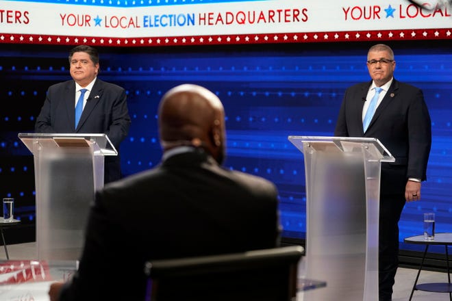 Gov. JB Pritzker, left, and Republican gubernatorial challenger state Sen. Darren Bailey participate in their second debate at the WGN9 studios on Tuesda in Chicago.