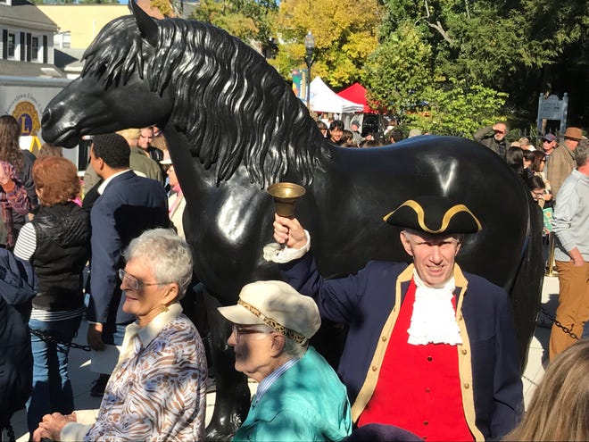Moorestown town crier William Archer rings his bell at the October dedication of a Percheron horse statue at the new  Percheron Park, the first park in the business district on Main Street.  The park honors the local man who first imported from France this breed of preferred work horse in the 1800s.