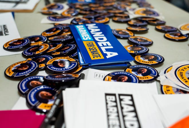 Campaign button and stickers available for Mandela Barnes supporters at a rally, October 8, at John Marshall High School in Milwaukee