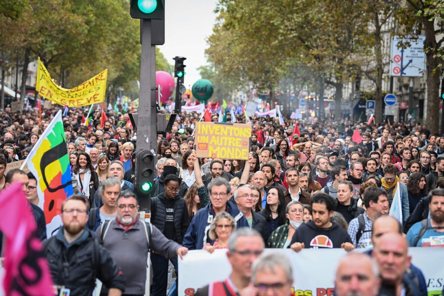 Protesters march during a demonstration in Paris, on October 18, 2022. Unions in other industries and the public sector have also announced action to protest against the twin impact of soaring energy prices and overall inflation on the cost of living.