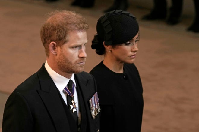 Prince Harry and Meghan, Duchess of Sussex leave Westminster Hall on September 14, 2022 in London during the funeral services for Queen Elizabeth II.
