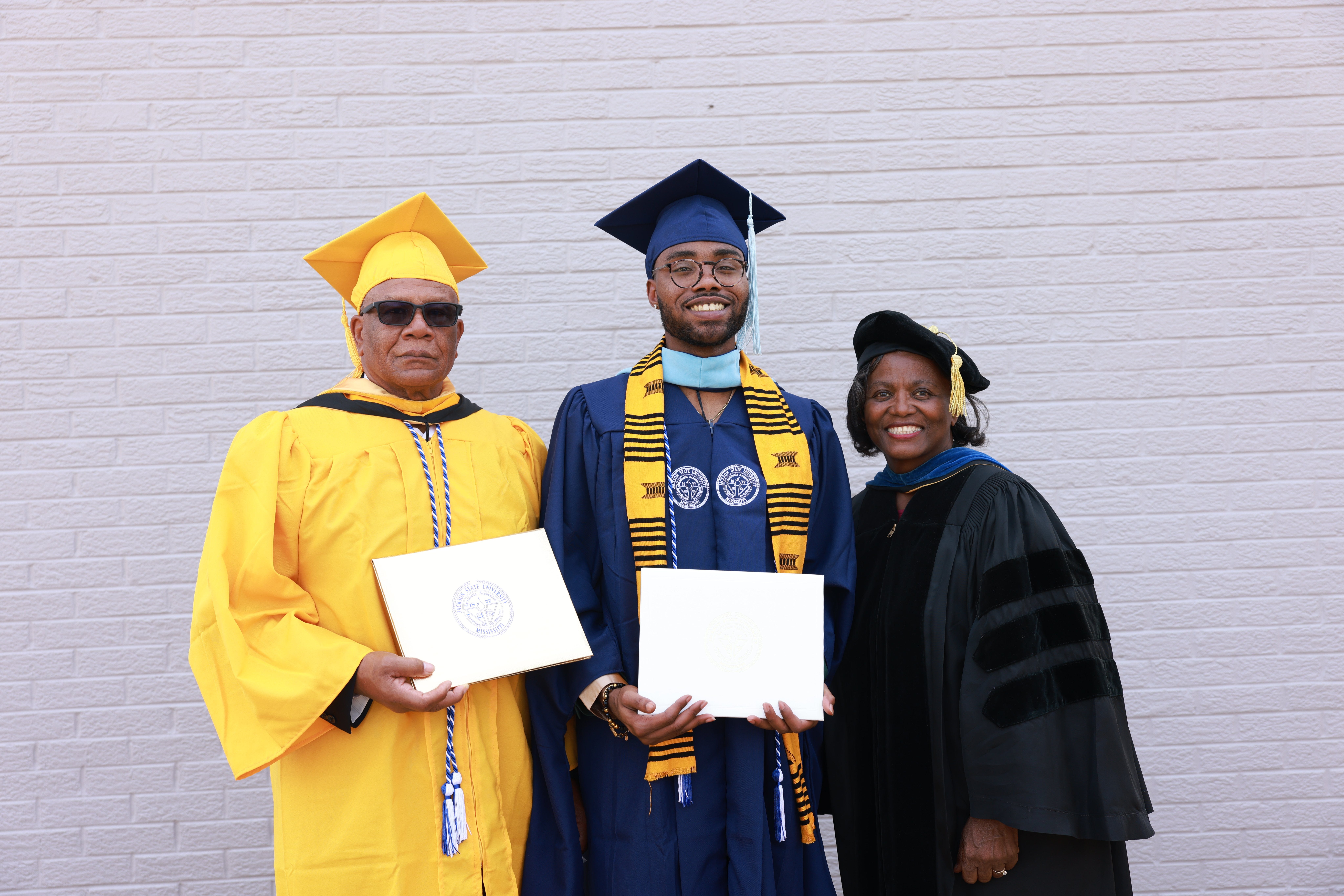 Jackson State University professor Pamela Banks at the spring 2022 JSU commencement ceremony in Jackson, Miss., with her second cousin, Symeon Butler (who received a master’s degree) and her first cousin, Donnie Banyard (left), who received a Golden Diploma marking the 50th anniversary of his graduation.