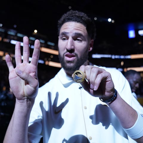 Golden State Warriors guard Klay Thompson receives