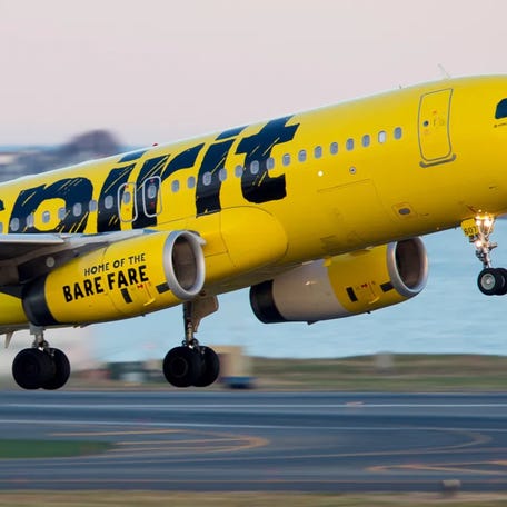 A Spirit Airlines Airbus A320 departs Boston Logan International Airport.