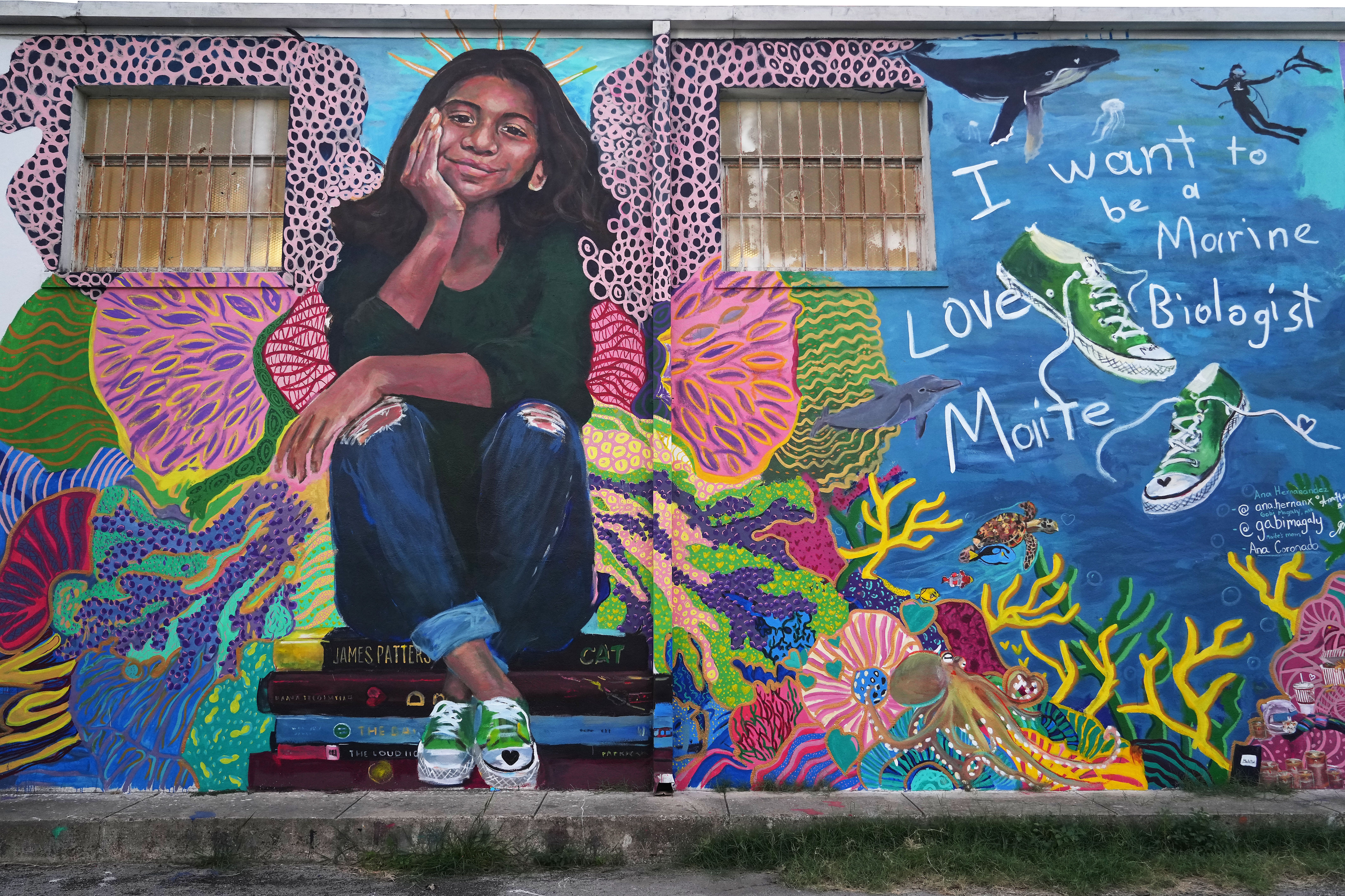 Maite Rodriguez is shown in her beloved green sneakers in a mural by artist Ana Hernandez on the St. Henry de Osso building in Uvalde, one of 21 murals honoring the Uvalde shooting victims.