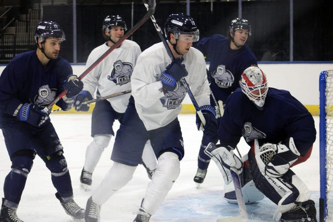 Jacksonville Icemen players scramble for the loose puck in front of the net during hockey practice at VyStar Veterans Memorial Arena on October 19, 2022. [Clayton Freeman/Florida Times-Union]