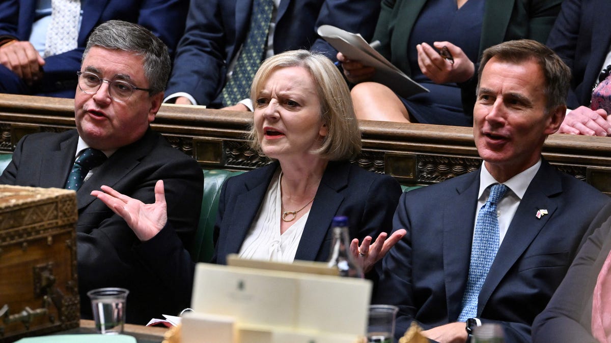 A handout photograph released by the UK Parliament shows Britain's Prime Minister Liz Truss (C) reacting during Prime Minister's Questions in the House of Commons in London on October 19, 2022. Truss is addressing lawmakers in parliament for the first time since abandoning her disastrous tax-slashing economic policies, as she fights for her political life.