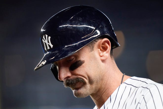 New York Yankees designated hitter Matt Carpenter reacts as he walks off the field after flying out to end the fourth inning of Game 3 of an American League Championship baseball series against the Houston Astros, Saturday, Oct. 22, 2022, in New York.