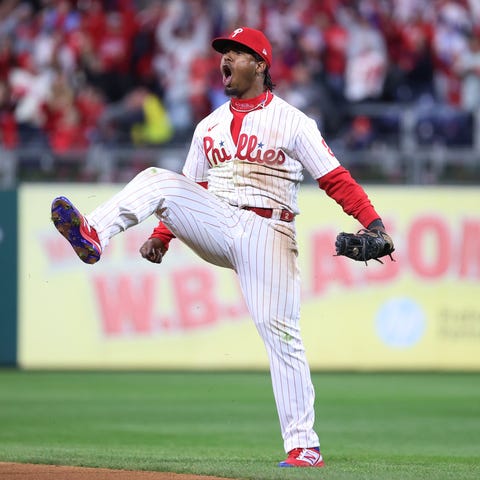 Phillies' Jean Segura celebrates after making a di