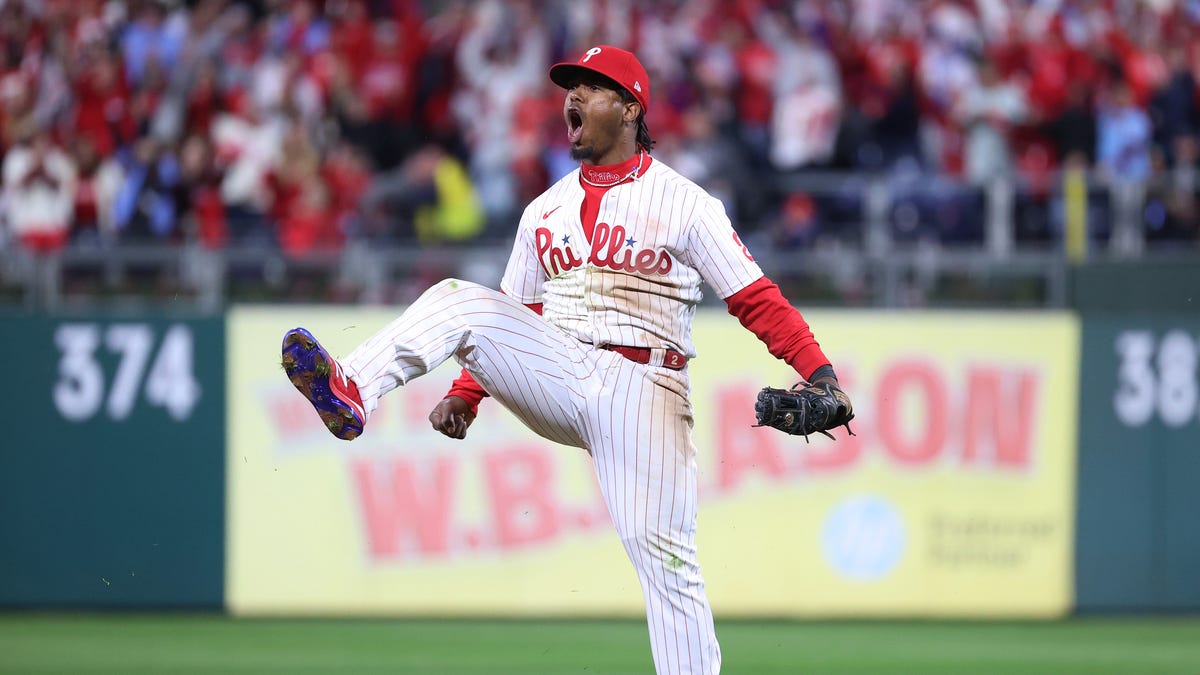 Phillies' Jean Segura celebrates after making a diving stop and throwing out Ha-Seong Kim in the seventh inning.
