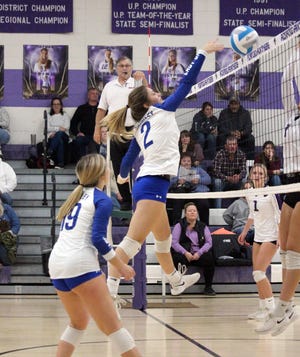 Brimley's Autumn Tremblay (2) gets up to record one of two solo blocks she recorded in Brimley's four-set win over the Pickford Panthers on Thursday night.
