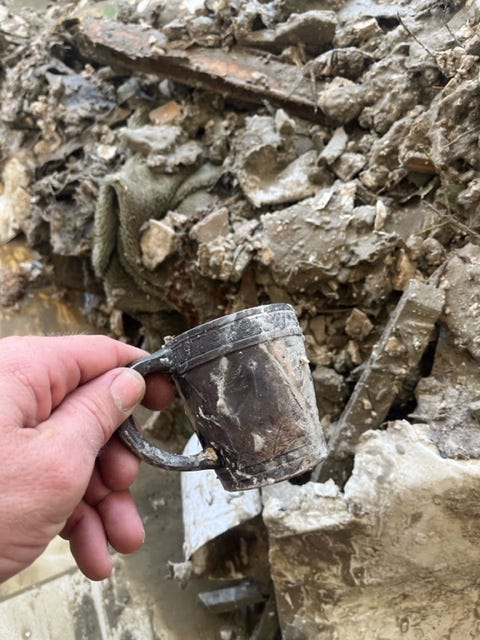 Among the few things Fort Myers Beach resident Mike Drumm found in his home after Hurricane Ian was this christening cup that belonged to his late grandfather.