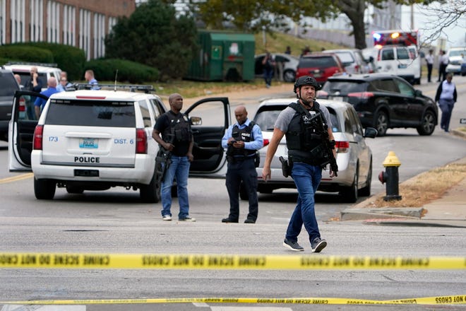 Law enforcement investigate the scene of a shooting at Central Visual and Performing Arts High School Monday, Oct. 24, 2022, in St. Louis.