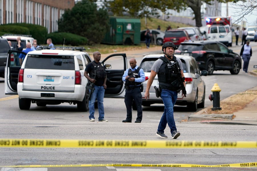 Law enforcement investigate the scene of a shooting at Central Visual and Performing Arts High School Monday, Oct. 24, 2022, in St. Louis.