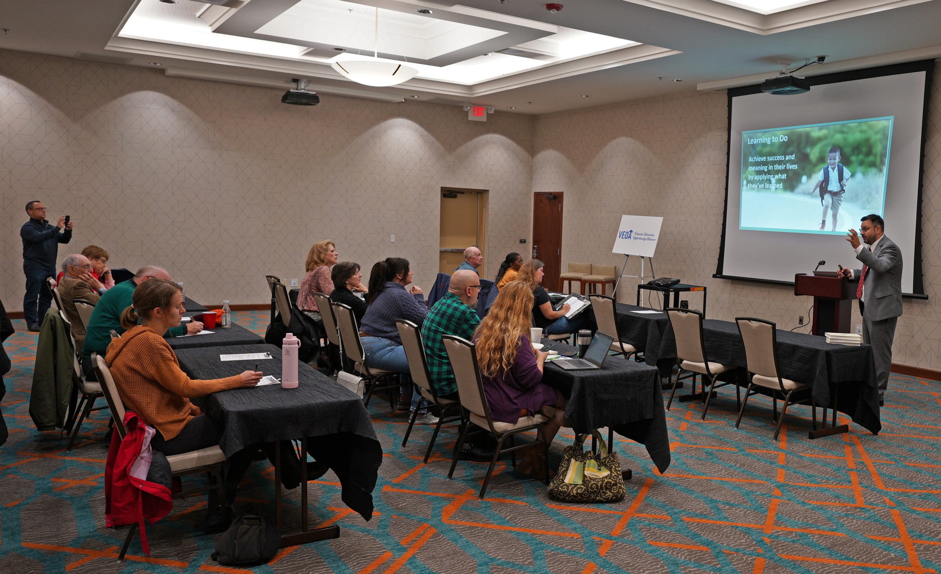 Christopher Stio, grassroots trainer and curriculum specialist, talks to a small group attending the Virginia Education Opportunity Alliance Saturday meeting which was offering free training for citizens to learn best practices to advance education choice. 