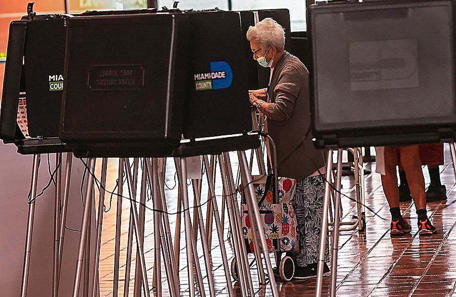 Miami-Dade residents cast their ballots during the first day of early voting in Miami-Dade County at the Miami-County Hall in downtown Miami, Monday, Oct. 24, 2022.