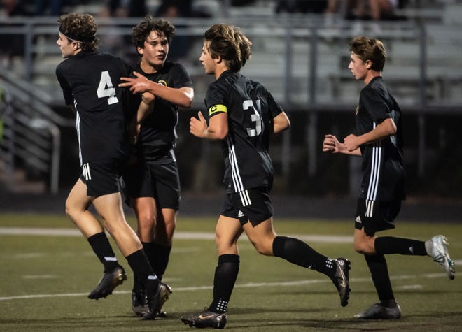 Quaker Valley soccer players celebrate their second goal over Freeport during their WPIAL 2A playoff game Monday at Chuck Knox Stadium in Leetsdale. [Lucy Schaly/For BCT]