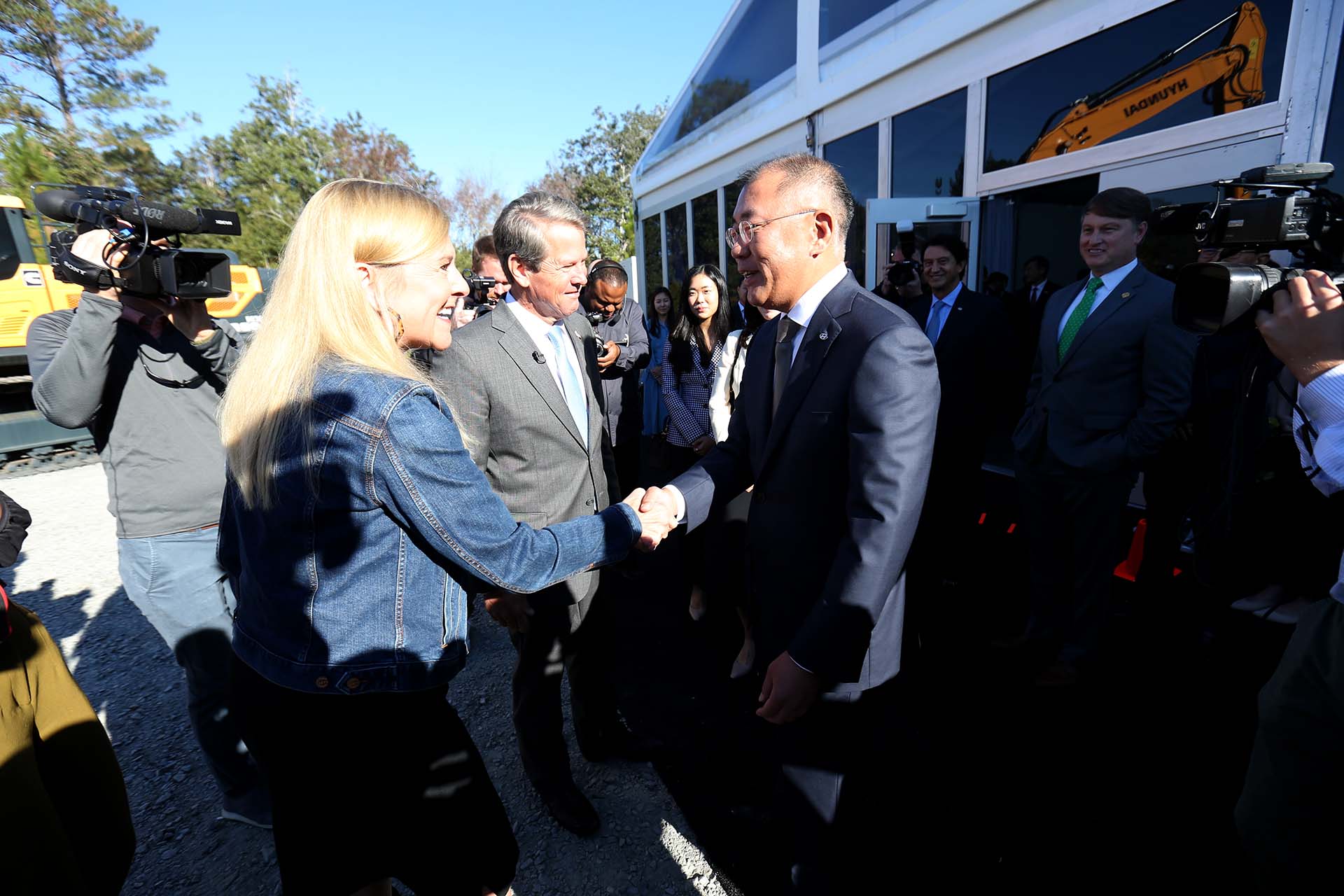 Hyundai CEO Euisun Chung greets Georgia Governor Brian Kemp and his wife Marty on Tuesday October 25, 2022, before the official groundbreaking ceremony for the Hyundai EV manufacturing facility at the Bryan County mega site near Ellabell, Georgia.