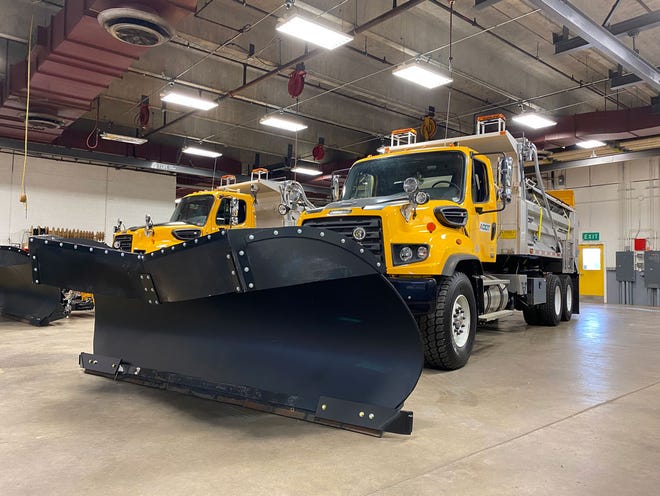 Two of ADOT's snowplows.