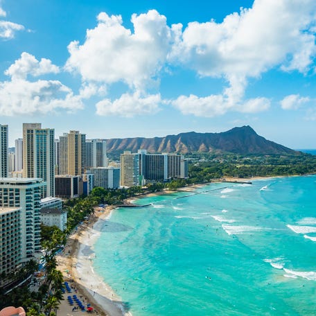 Waikiki Beach and Diamond Head Crater including the hotels and buildings in Waikiki, Honolulu, Oahu island, Hawaii.