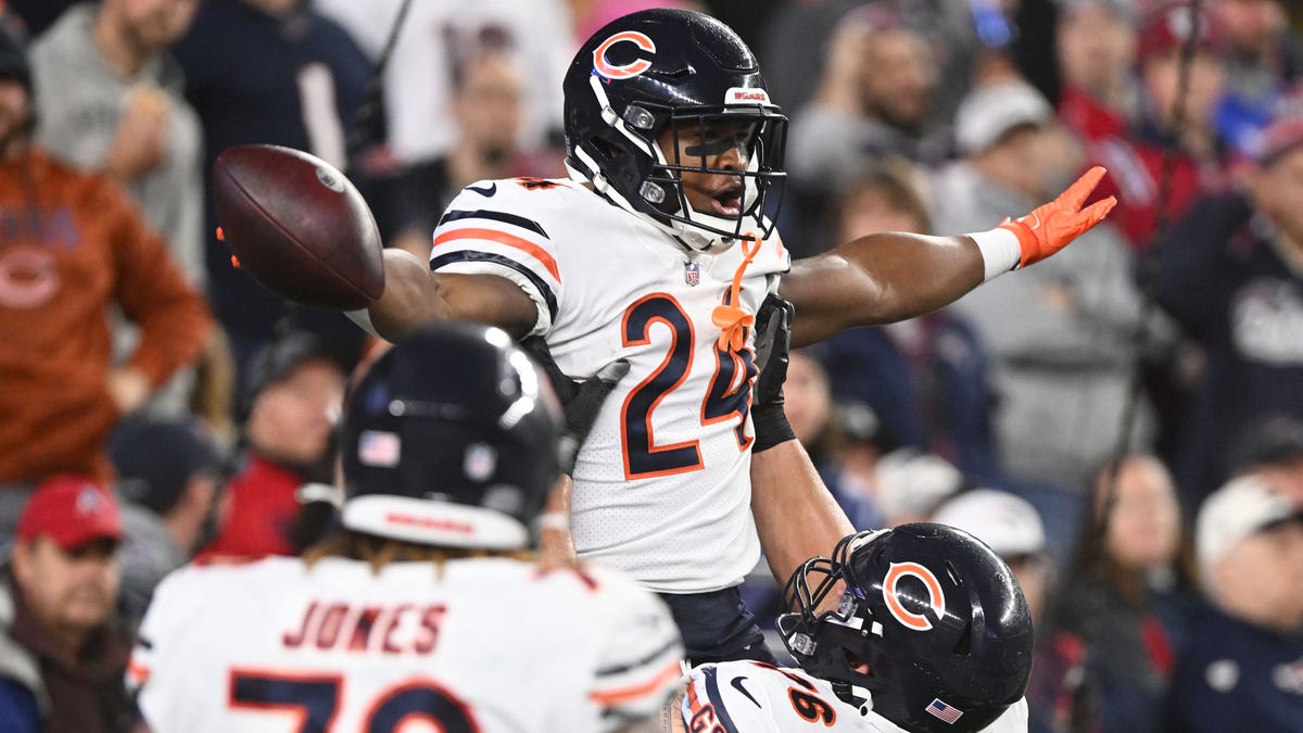 Chicago Bears running back Khalil Herbert (24) celebrates after scoring a touchdown against the New England Patriots.