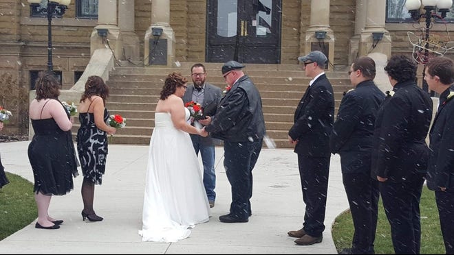 Curtis and Shannon Bromer returned to downtown Cambridge to be married in front of the courthouse, as their first date included strolling through Dickens Village.