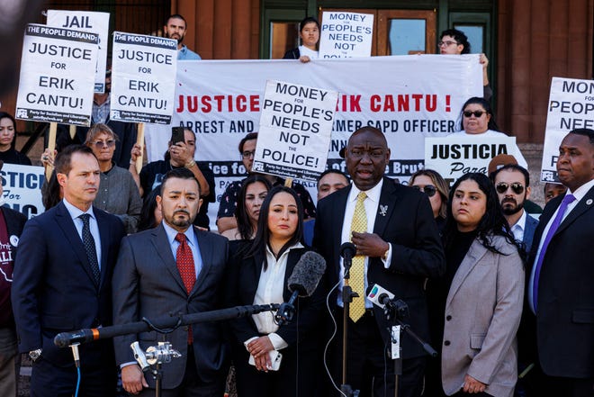 Attorney Benjamin Crump, third from right, addresses the media alongside 17-year-old Erik Cantu's family during a press conference held to update the public about his current medical condition in front of the Bexar County Courthouse in San Antonio, Tuesday, Oct. 25, 2022. Cantu was shot multiple times by former San Antonio police officer James Brennand  on Oct. 2.