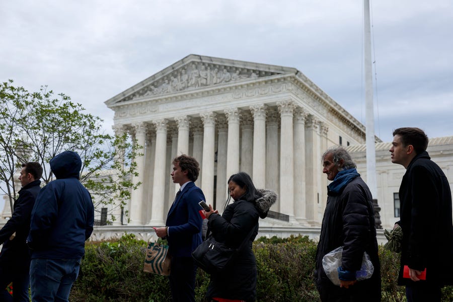 WASHINGTON, DC - OCTOBER 03: People wait in line outside the U.S. Supreme Court Building to hear oral arguments on October 03, 2022 in Washington, DC. The Court is hearing oral arguments for the first set of cases today which are Sackett v. Environmental Protection Agency and Delaware v. Pennsylvania and Wisconsin. (Photo by Anna Moneymaker/Getty Images) ORG XMIT: 775881863 ORIG FILE ID: 1430024936