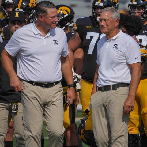 Iowa football coach Kirk Ferentz (right) with his 