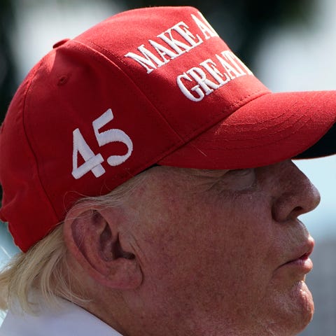 Former President Donald Trump stands on the course