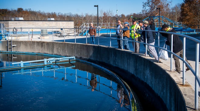 Jason Lasher leads a tour at Dillman Road Wastewater Treatment Plant during an open house to show the improvements to the facility.