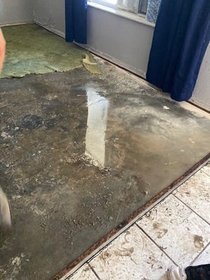 Water damage in the floors of Wendy Summerson's home in North Port after Hurricane Ian.