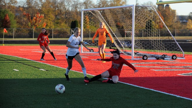 Unioto's Autumn Stanger (#37) and Fairfield Union's Nella Stansberry (#21) fight for the ball in a girls soccer Division II district finals match at Piketon High School on Oct. 27, 2022. Fairfield Union won the match 1-0 in double overtime.