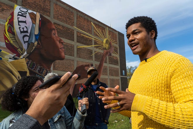 Artist Waleed Johnson of Detroit talks about his mural "The Spirit" on Van Dyke Street in Detroit on Friday, October 28, 2022.