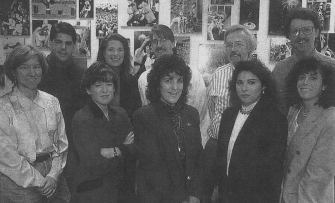 Bruce Locklin, fourth from left in the back row, is seen with newsroom colleagues in 1996.