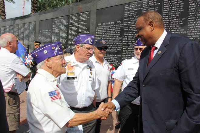 Congressman Al Lawson Jr. greeting veterans.