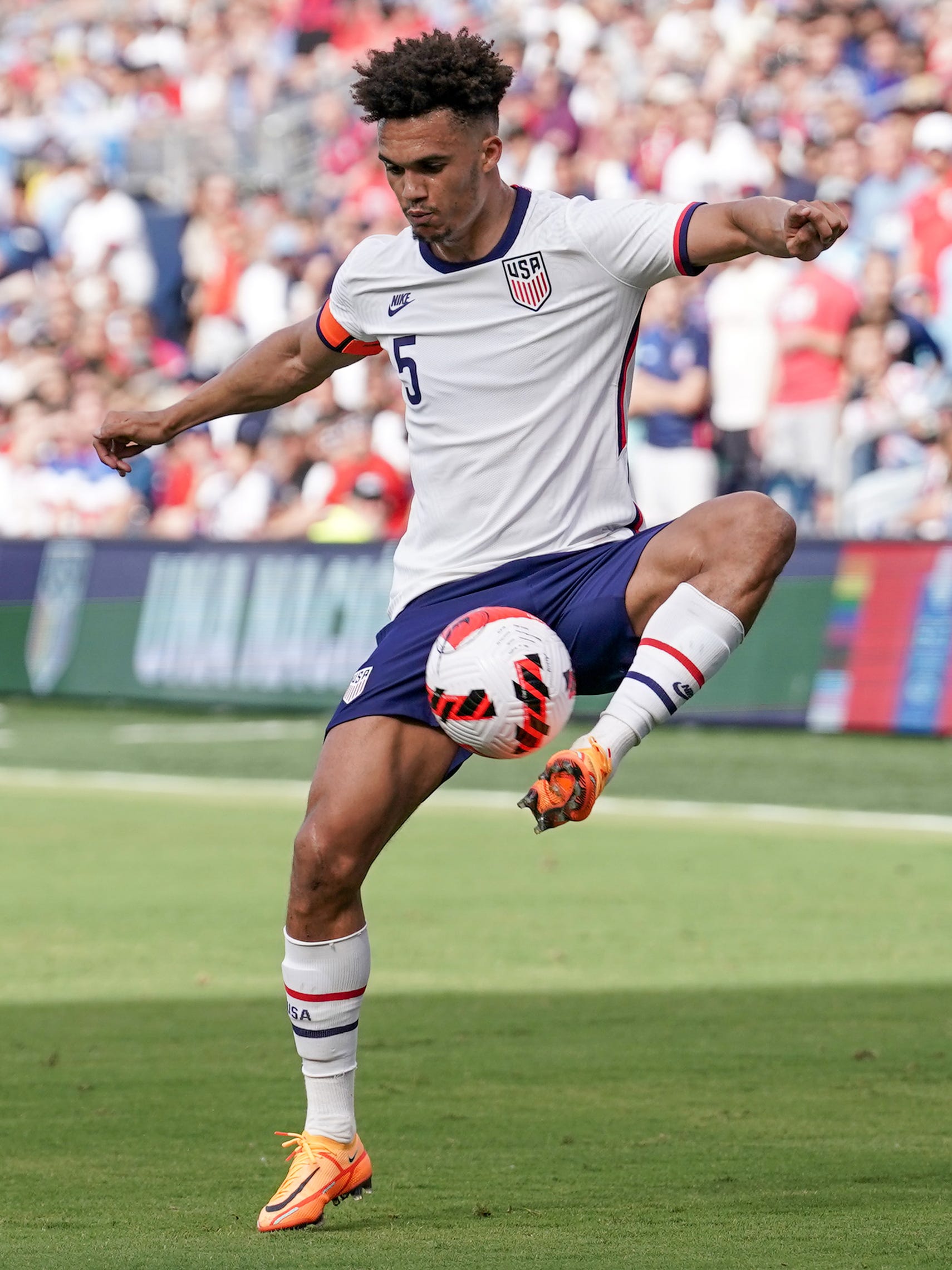 An action image of Antonee Robinson  playing soccer.