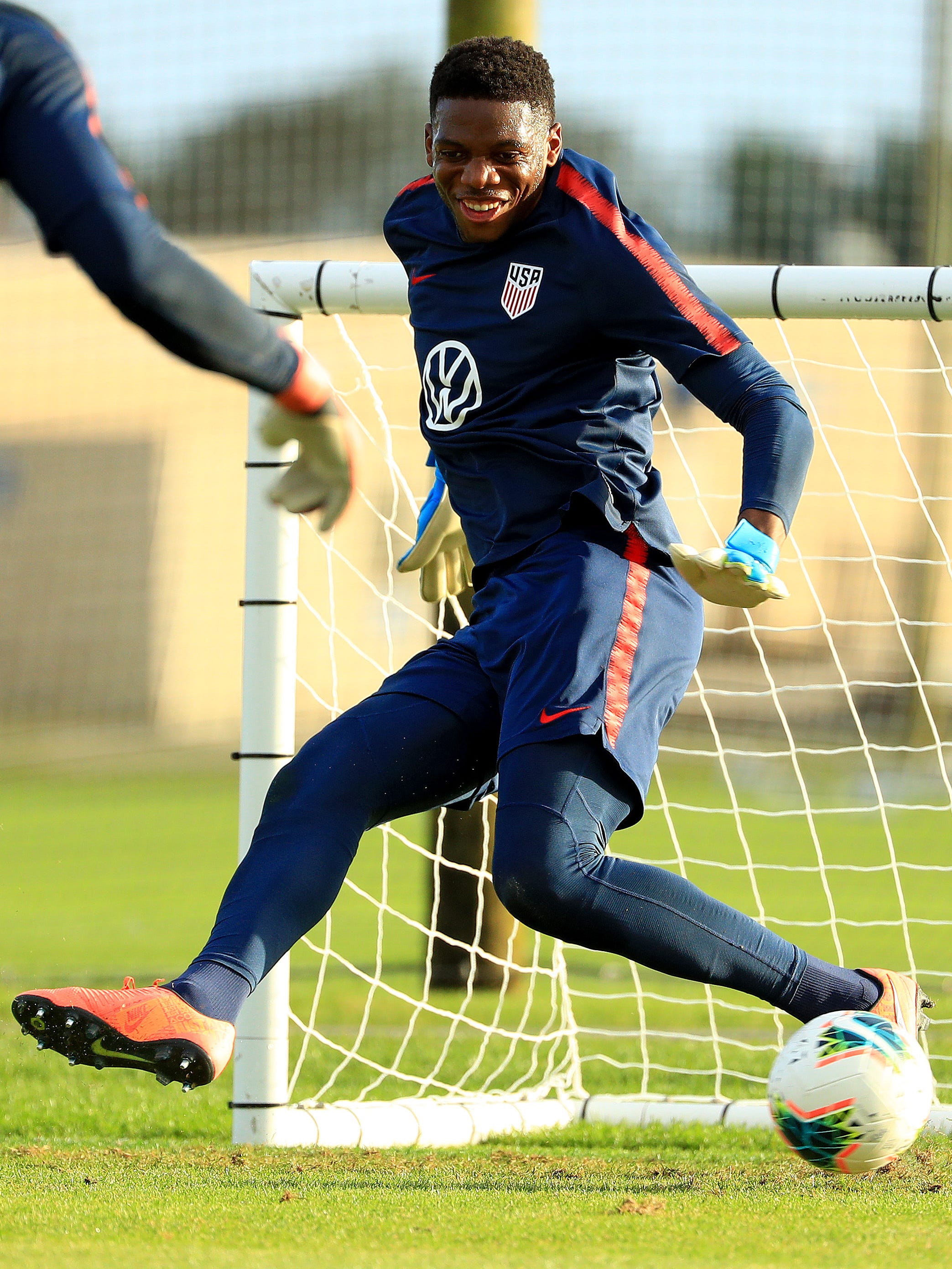 An action image of Sean Johnson  playing soccer.