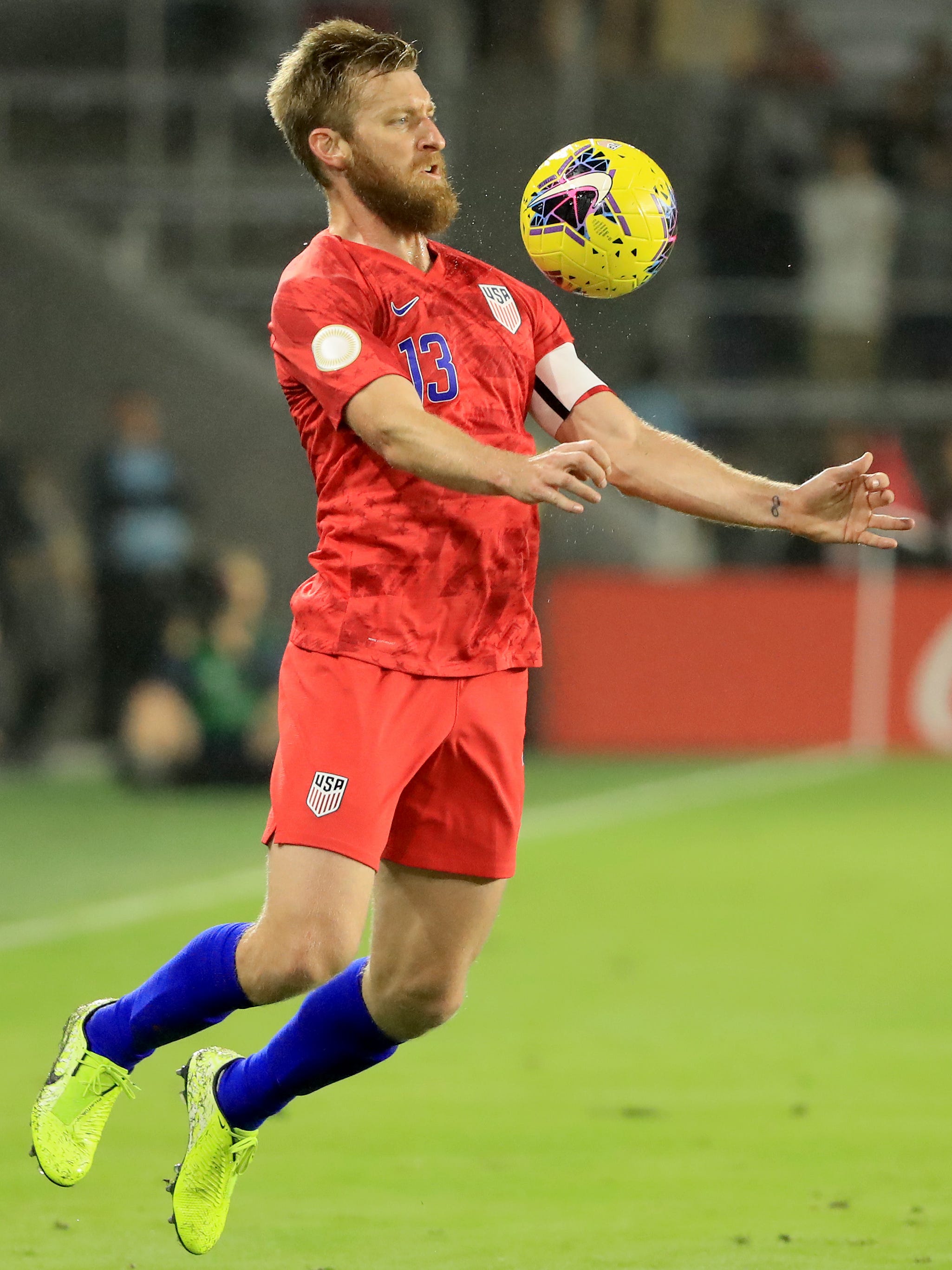 An action image of Tim Ream  playing soccer.